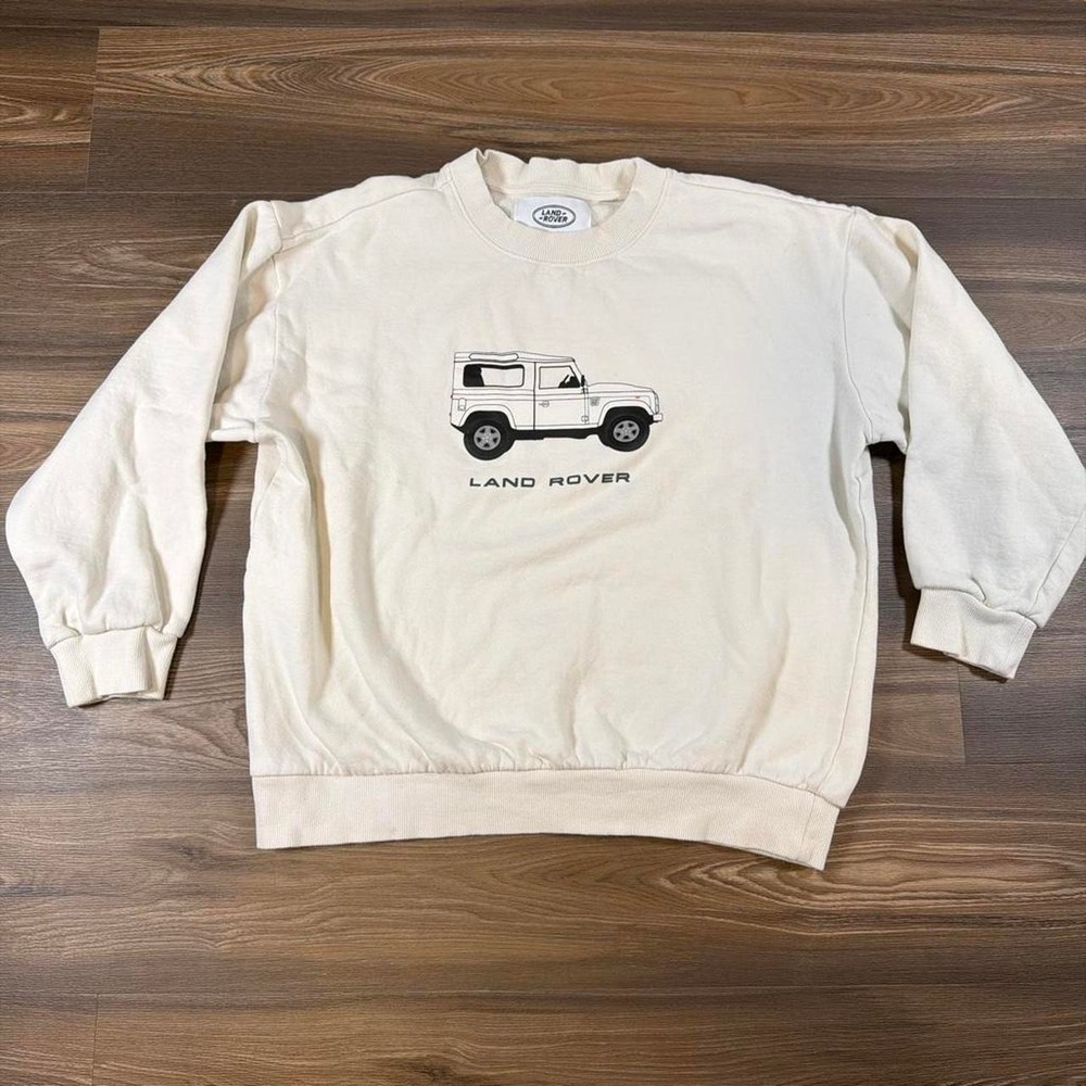 Cream Land Rover crewneck sweatshirt with white outline of a Land Rover vehicle